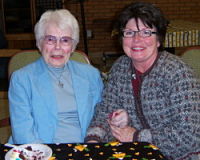 Two women sitting at a table. 