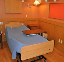 Inside of the Extended Care room including bed and lights.